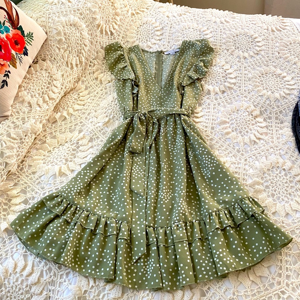 Green ruffle hem dress with white polka dots